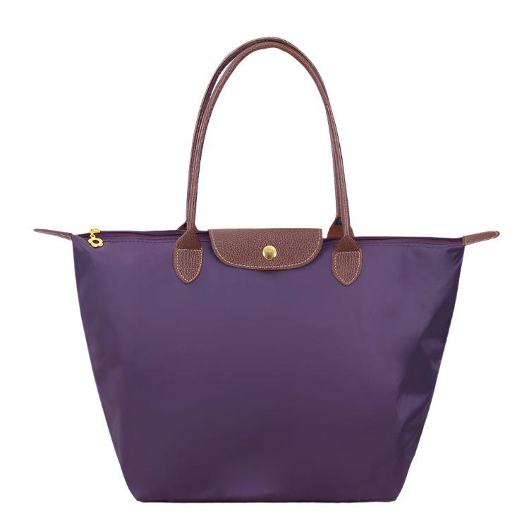 Women’s shoulder bag with compact silhouette and functional compartments
