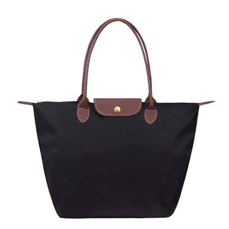 Women’s shoulder bag with compact silhouette and functional compartments