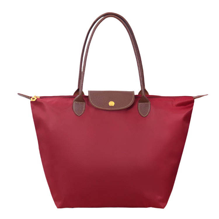 Women’s shoulder bag with compact silhouette and functional compartments