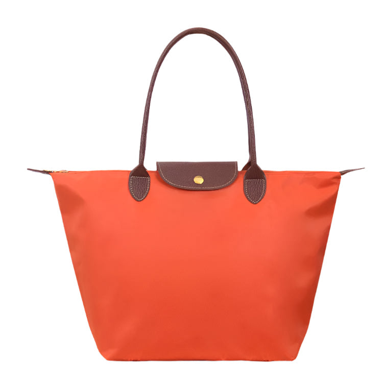 Women’s shoulder bag with compact silhouette and functional compartments